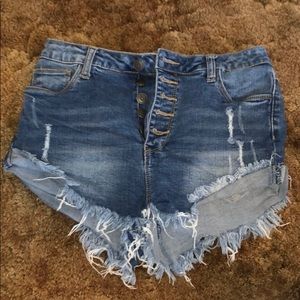 Distressed button up blue jean shorts